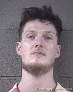Mugshot of John Riley Cooper booked in Buncombe County, North Carolina on August 25, 2026