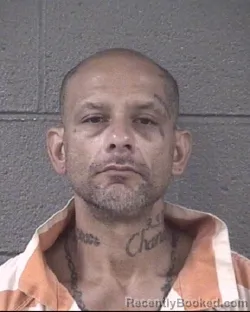 Mugshot of John Carlos Flores booked in Buncombe County, North Carolina on August 26, 2026