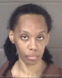 Mugshot of KAYLA TREMAINE HOLIDAY booked in Buncombe County, North Carolina on March 21, 2026