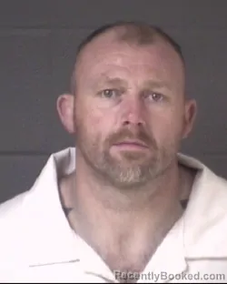 Mugshot of TRAVIS WARREN GLENN booked in Buncombe County, North Carolina on March 18, 2026