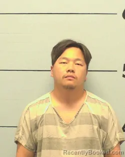 Mugshot of JACKIE VANG booked in Burke County, North Carolina on March 24, 2026