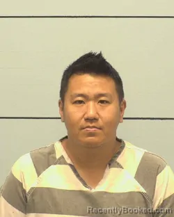 Mugshot of JESSE YANG booked in Burke County, North Carolina on May 12, 2026