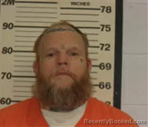 Mugshot of DUSTIN COREY MOORE booked in Caswell County, North Carolina on April 22, 2026