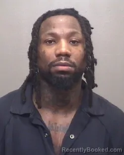 Mugshot of TAVARUS QUINTEZ RHYNES