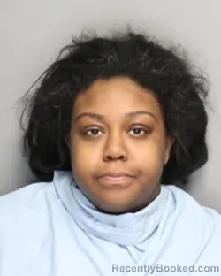 Mugshot of Unique Nicole Mcclain-Motton booked in Champaign County, Illinois on October 1, 2026