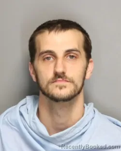 Mugshot of Brandon Michael Unzicker booked in Champaign County, Illinois on September 21, 2026