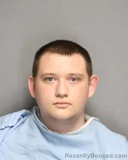 Mugshot of GAVIN AIDEN BODHI BAUER booked in Champaign County, Illinois on May 12, 2026