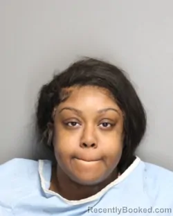 Mugshot of UNIQUE NICOLE MCCLAIN-MOTTON booked in Champaign County, Illinois on May 15, 2026