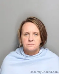 Mugshot of CHRISTINE ANN RHODES booked in Champaign County, Illinois on June 20, 2026