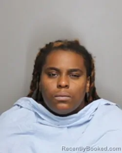 Mugshot of QUIOSHA TIARA HOLMAN booked in Champaign County, Illinois on June 24, 2026