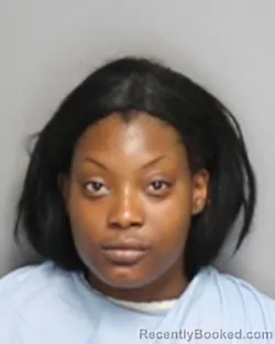 Mugshot of CHARMAINE CHANEL WOODS booked in Champaign County, Illinois on June 30, 2026