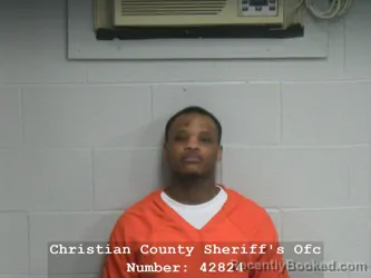 Mugshot of DEZZMEND C ROGERS booked in Christian County, Illinois on April 1, 2026