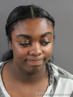 Mugshot of JASMINE KHABIJA REED booked in Coles County, Illinois on March 25, 2026