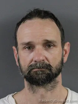 Mugshot of DUSTIN MICHAEL HELLMAN booked in Coles County, Illinois on May 13, 2026