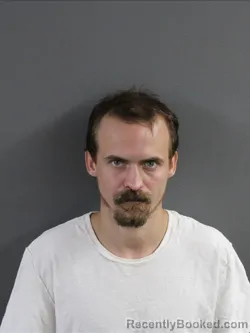 Mugshot of ADAM HACKETT booked in Coles County, Illinois on July 8, 2026