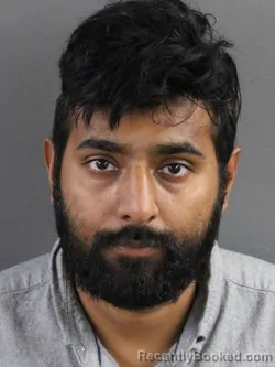 Mugshot of Mandar Patel booked in Coles County, Illinois on August 8, 2026