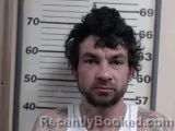 Mugshot of CHRISTIAN M SIMMONS