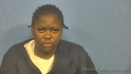 Mugshot of LOUISE NGAMELEIU-PETHE booked in DuPage County, Illinois on April 11, 2026