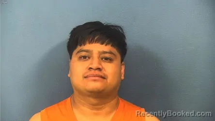 Mugshot of Miguel Entzin-Gomez booked in DuPage County, Illinois on August 9, 2026