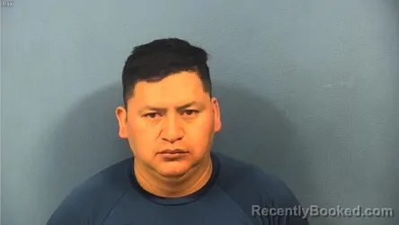 Mugshot of Mario Zacarias-Macario booked in DuPage County, Illinois on October 5, 2026
