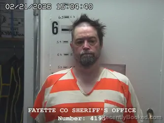 Mugshot of JOHN D MCGINNESS