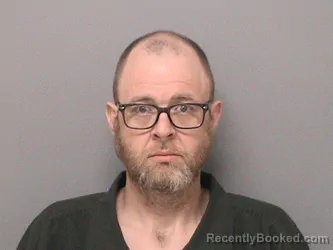 Mugshot of TRAVIS J SCHOENING