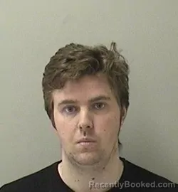 Mugshot of TYLER GARY BARTON booked in Kane County, Illinois on May 10, 2026