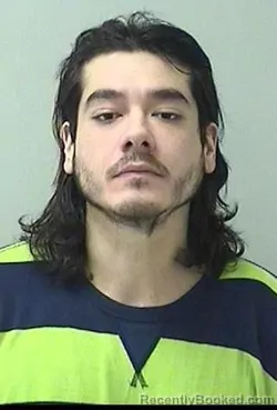Mugshot of Sergio Manuel Esparza booked in Kane County, Illinois on August 24, 2026