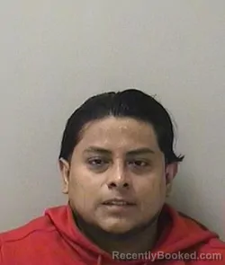 Mugshot of Alvaro J Reyes-Garcia booked in Kane County, Illinois on August 25, 2026