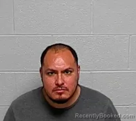 Mugshot of Alberto Flores booked in Lake County, Illinois on August 23, 2026