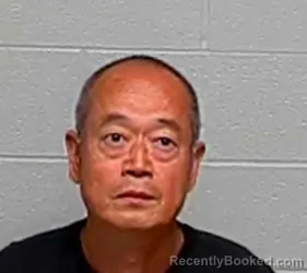 Mugshot of JIQUAN WANG booked in Lake County, Illinois on June 22, 2026