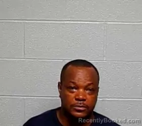 Mugshot of AHMANNOSI GABRIEL ETAMIOMOH booked in Lake County, Illinois on July 10, 2026