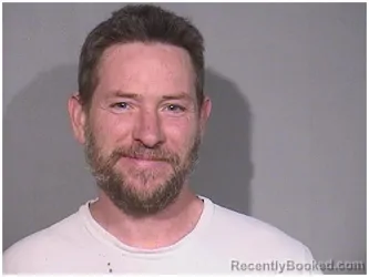 Mugshot of GRAYDON C REED