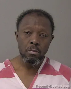 Mugshot of JOSEPH MBATCHOU booked in Macon County, Illinois on March 19, 2026