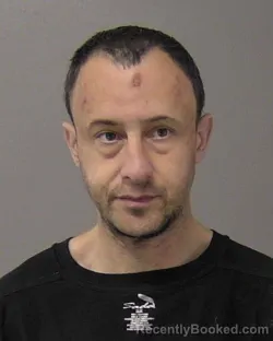 Mugshot of KYLE RICHARD SZABO booked in Macon County, Illinois on March 21, 2026