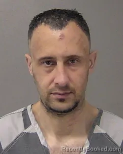 Mugshot of KYLE RICHARD SZABO booked in Macon County, Illinois on March 25, 2026