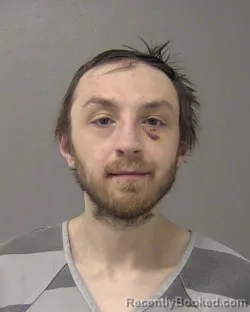 Mugshot of DUSTIN WILLIAM RICHARD ROBINSON-BEATY booked in Macon County, Illinois on April 6, 2026