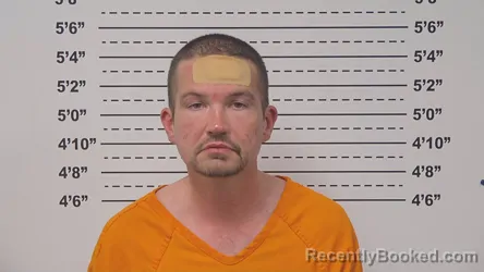 Mugshot of DUSTIN HUGGINS booked in Macoupin County, Illinois on March 31, 2026