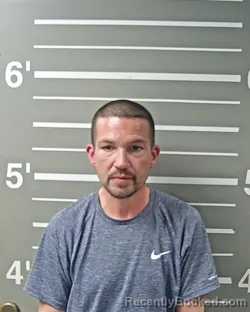 Mugshot of DUSTIN W HUGGINS