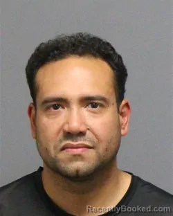 Mugshot of John William Aponte booked in Guilford County, North Carolina on August 29, 2026