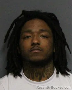 Mugshot of JUSTICE LAMONT WILLIAMS booked in Guilford County, North Carolina on March 24, 2026