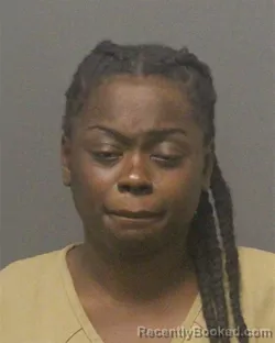 Mugshot of NAFISATOU REMEMBER WESSEH booked in Guilford County, North Carolina on July 14, 2026
