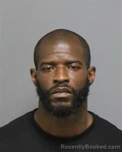 Mugshot of Travis Devon Moore booked in Guilford County, North Carolina on August 21, 2026