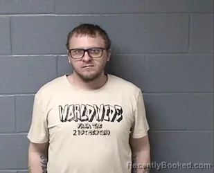 Mugshot of JUSTIN A TRAVIS