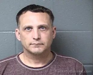 Mugshot of JUSTIN D SCHUMACHER