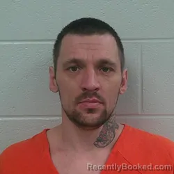 Mugshot of Yuri Benjamin Neumann booked in Carroll County, Indiana on September 30, 2026