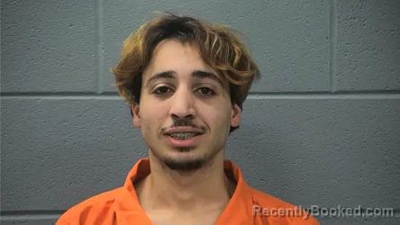 Mugshot of CHEM EDDINE BOUDJENOUIA