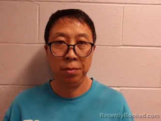 Mugshot of GUAN, JUNWEI booked in Clay County, Indiana on April 24, 2026