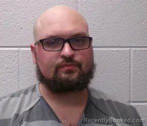 Mugshot of Ryan Joseph Stutzman booked in Henderson County, North Carolina on October 7, 2026