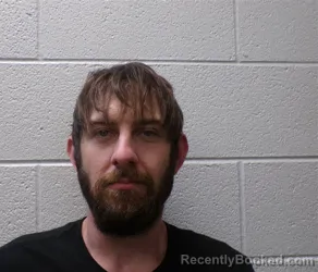 Mugshot of JONATHAN ALEXANDER BLAKE BUFORD booked in Henderson County, North Carolina on March 26, 2026